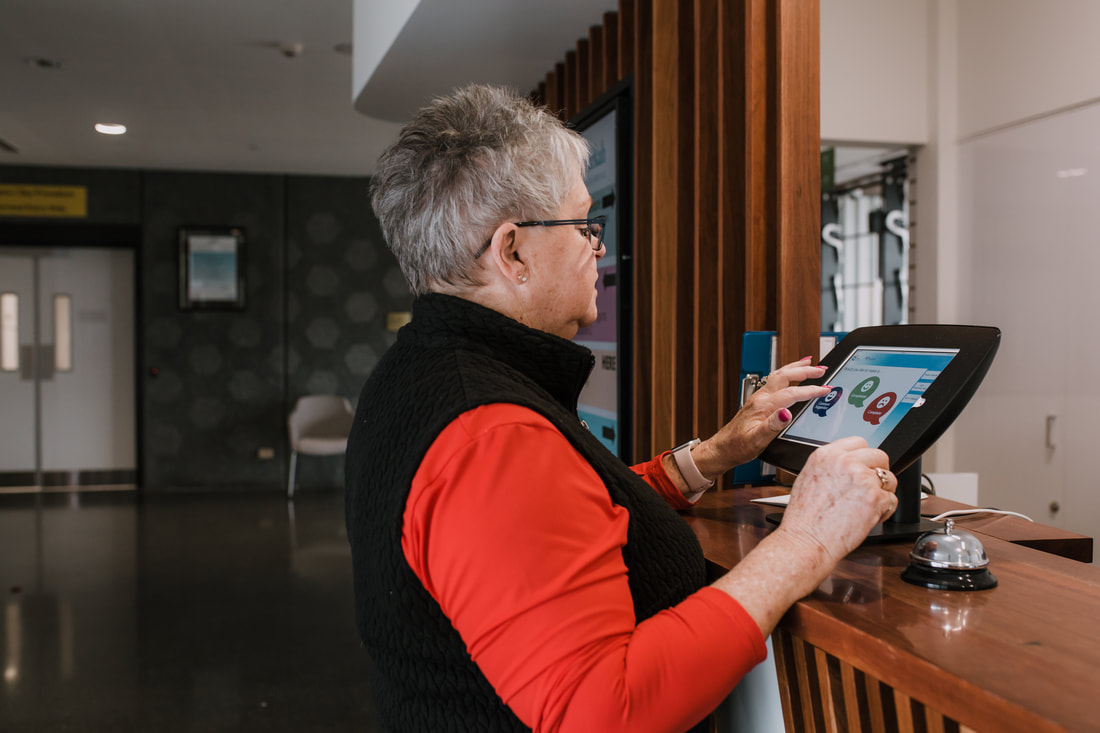 A female patient provides feedback via one of the electronic feedback hubs available at Nathalia and Numurkah hospitals.
