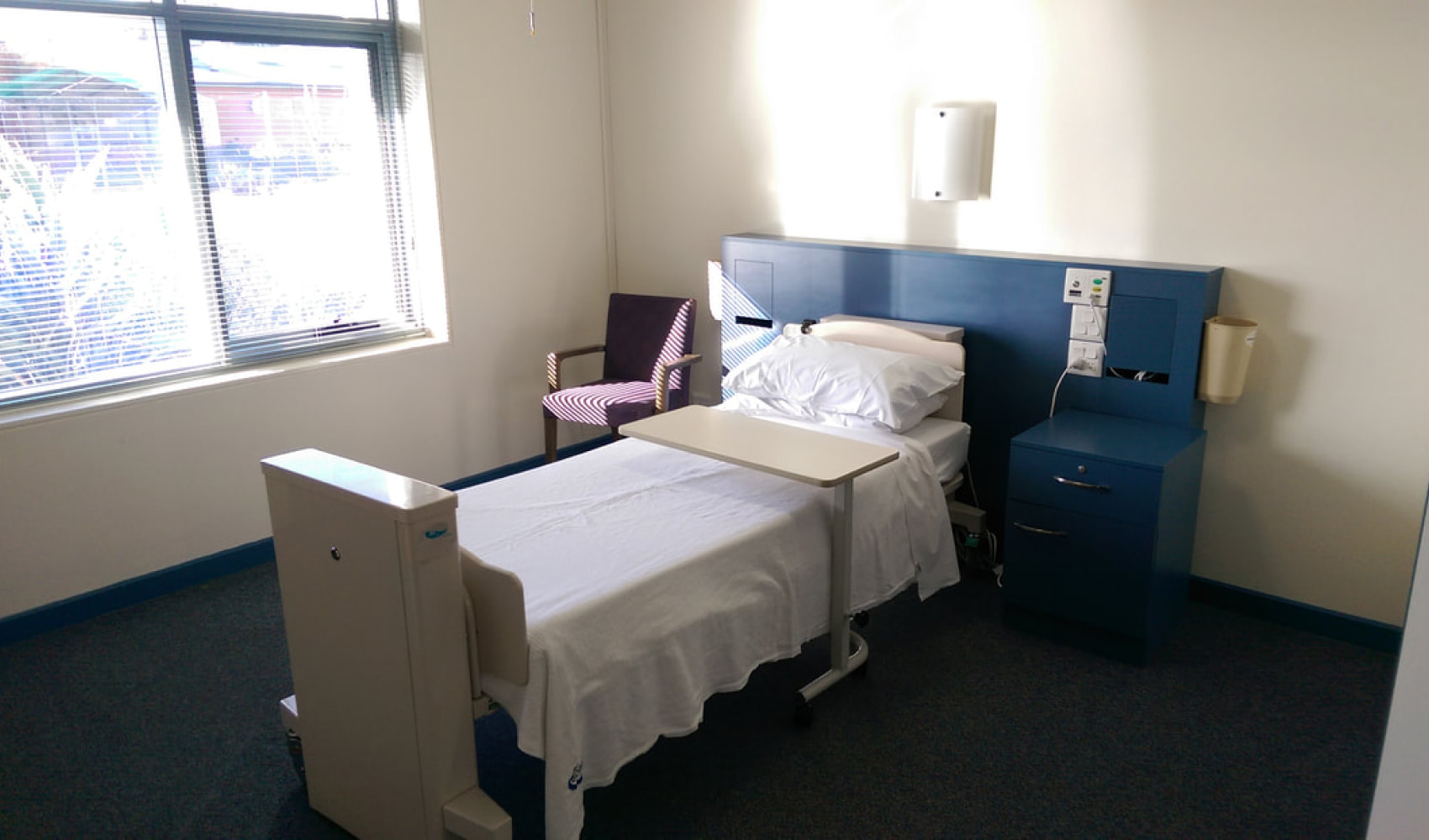 A bed in one of the nursing home rooms. 