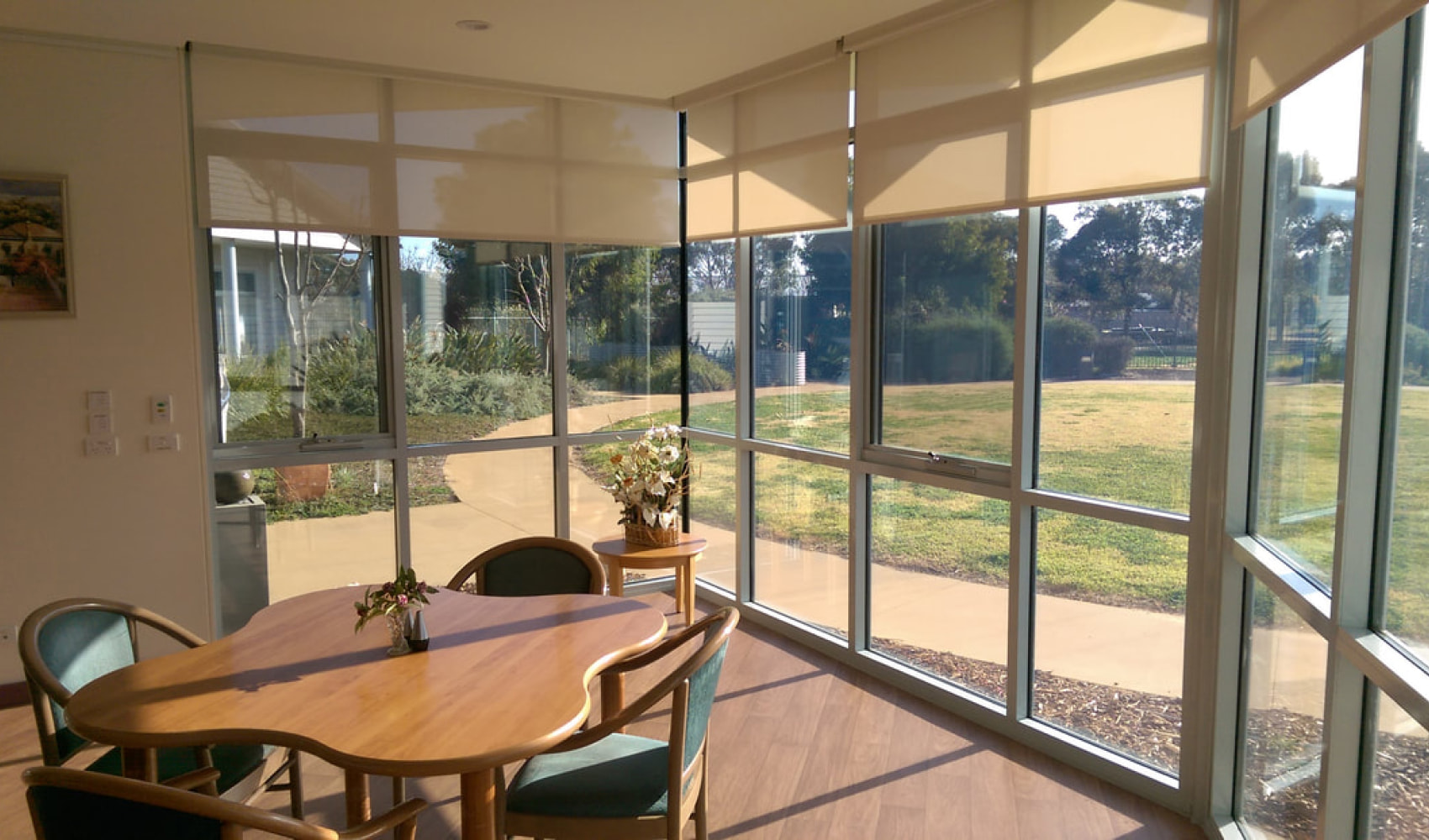 A 4 person dining table by the window. 